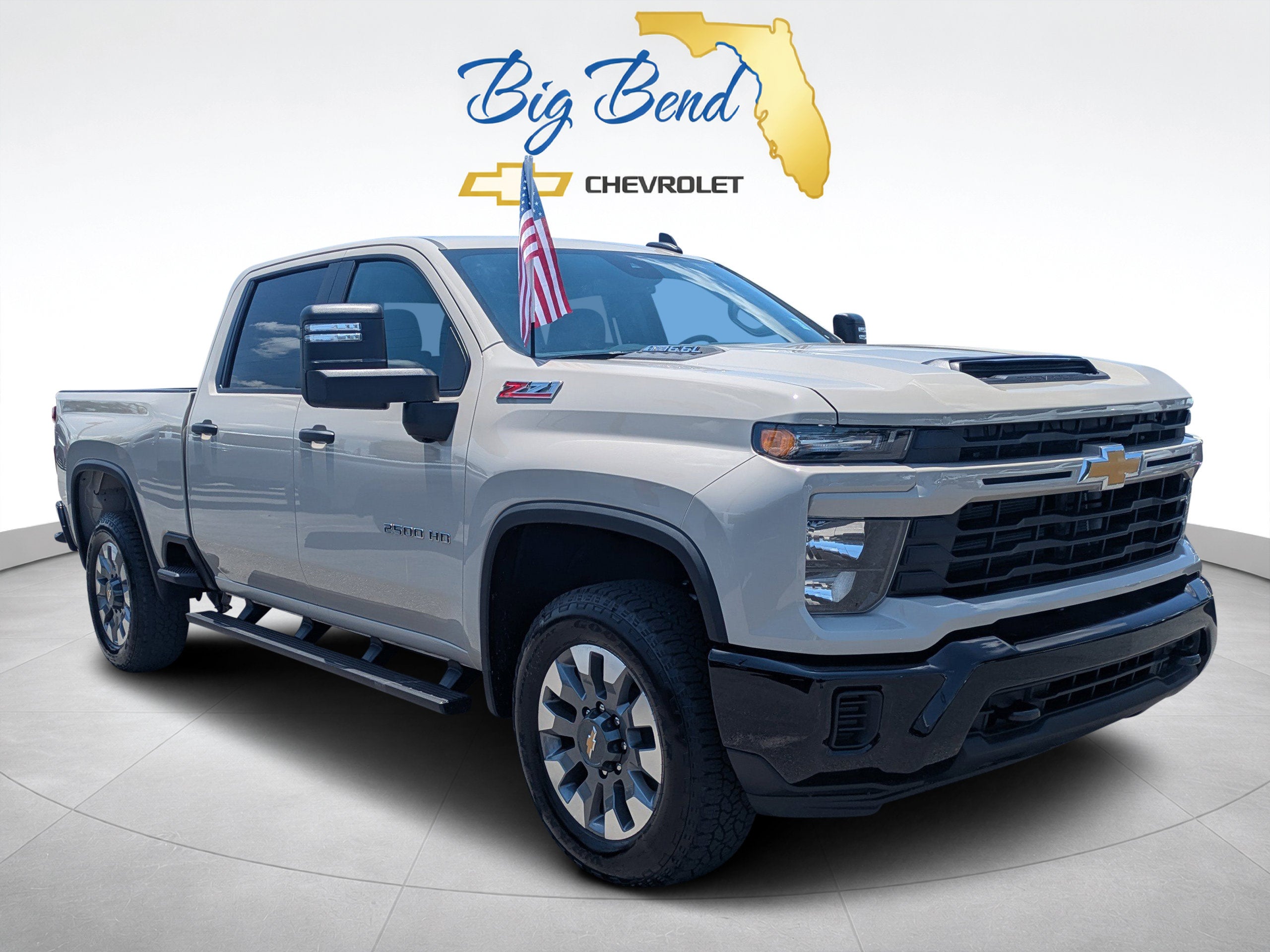 2026 Chevrolet Silverado 2500 HD Custom in White Sands — front three-quarter view