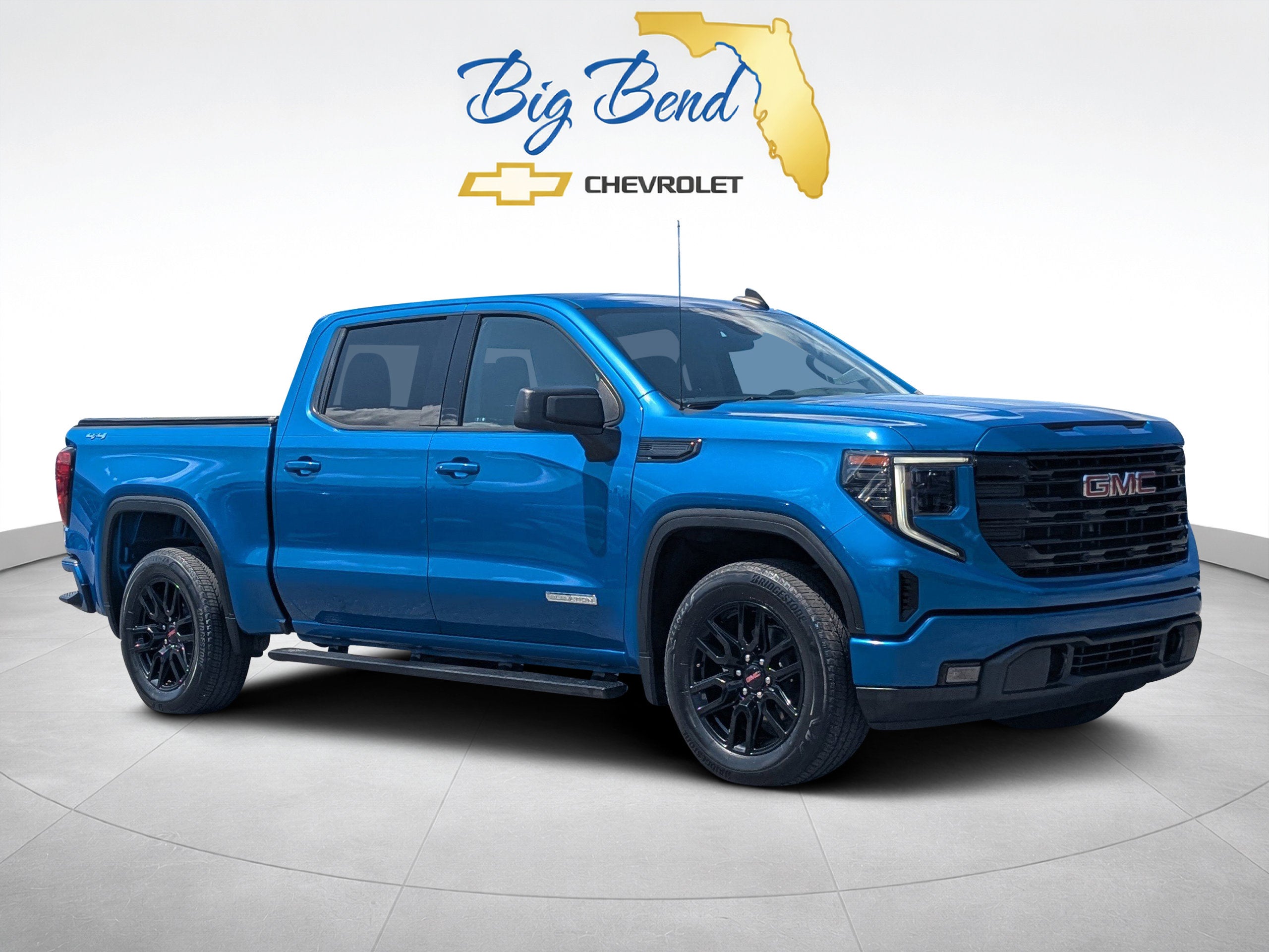 2023 GMC Sierra 1500 Elevation in Dynamic Blue Metallic — front three-quarter view